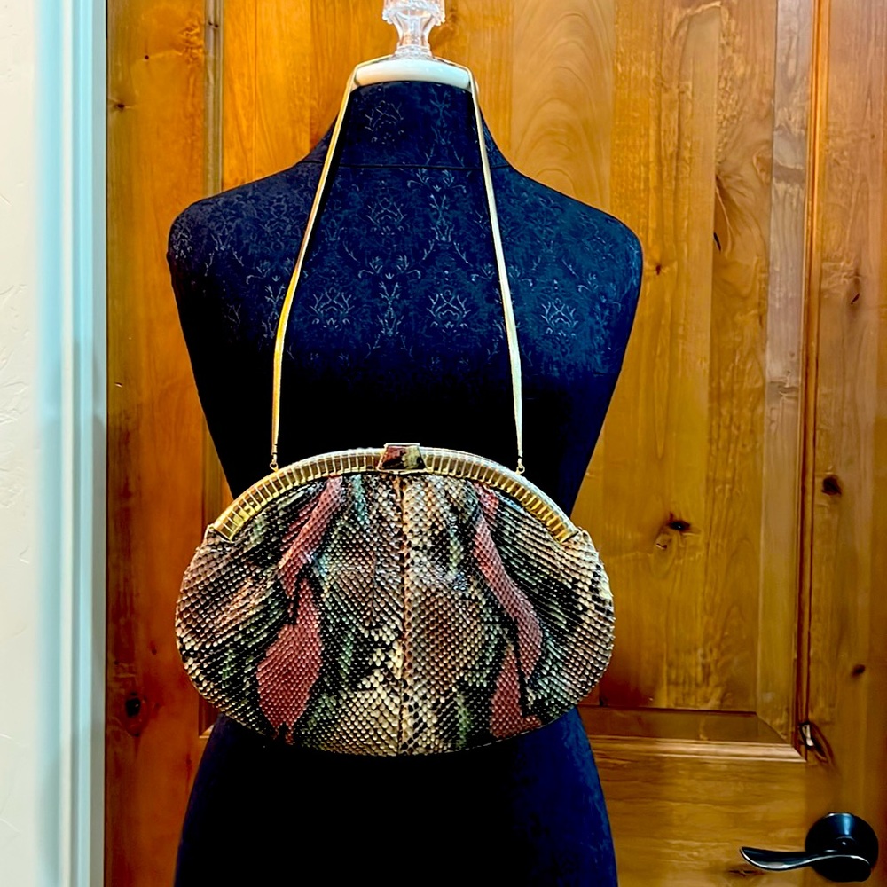 This is a Judith Lieber snake anaconda purse
